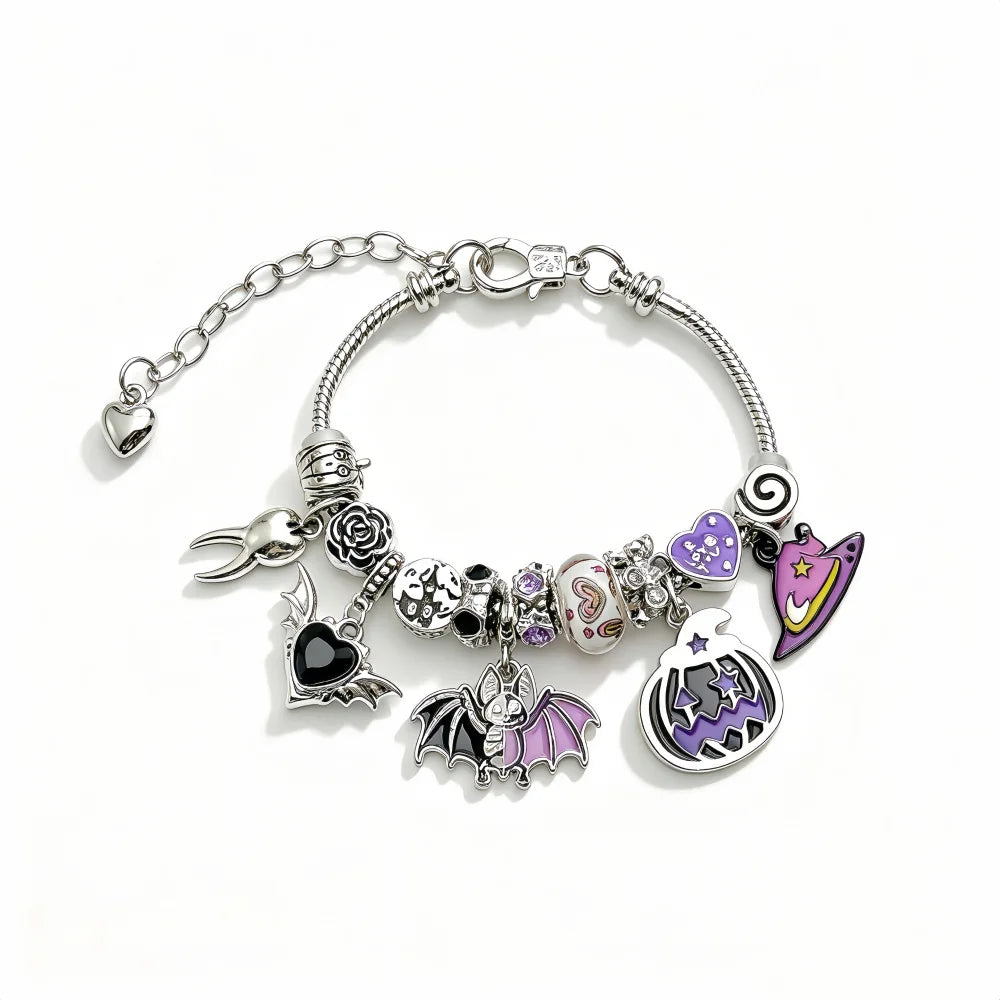 Pumpkin and bat charm bracelets side by side
