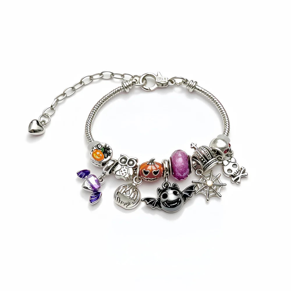 Detail of silver Halloween charms on a chain bracelet