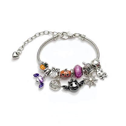 Detail of silver Halloween charms on a chain bracelet