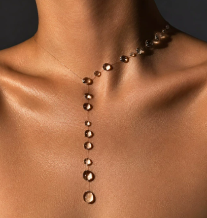 Crystal Drop Lariat Necklace worn on model, graduated crystal droplets cascading down a delicate chain